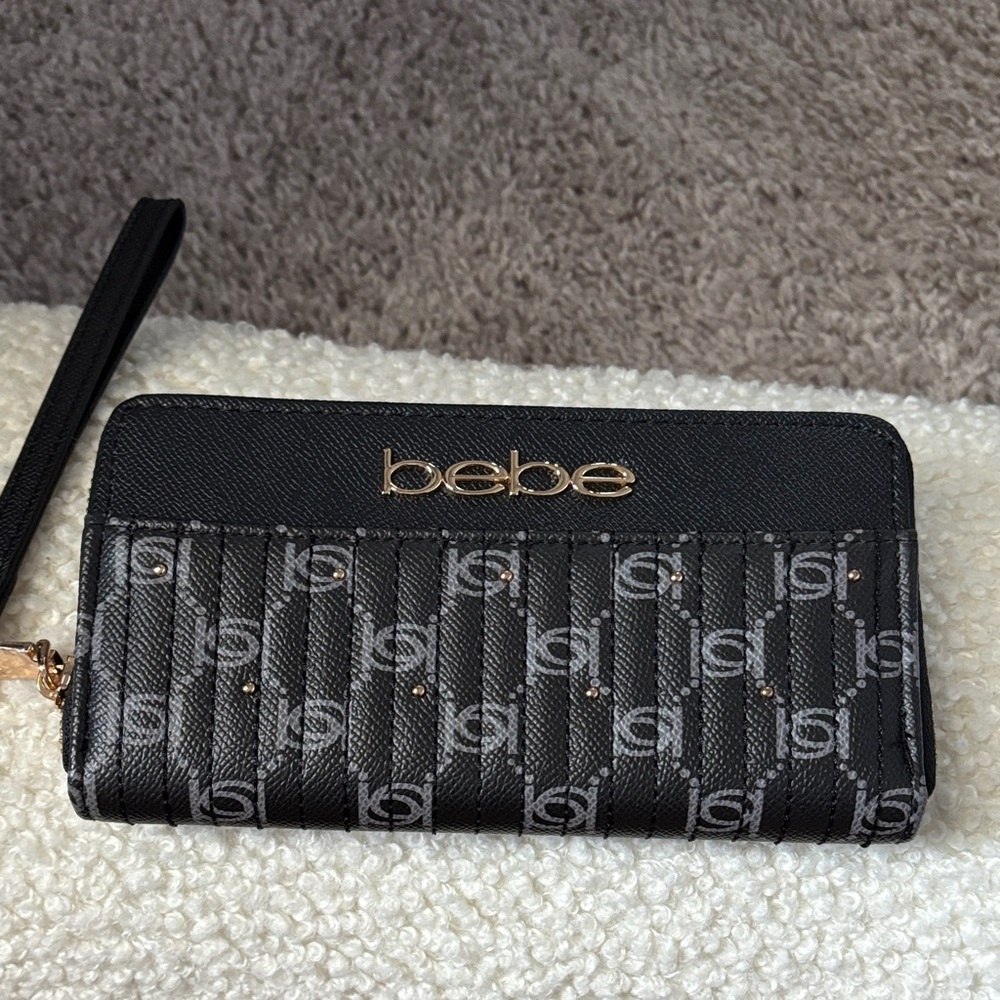 Bebe Black and Gold Logo Wristlet. NWOT